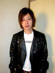 Japanese boy sitting on the floor and jerking