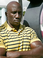 Big black man showing his nude and hairy chest