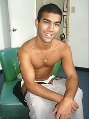 Hot latin dude Andres jerks his cock on black sofa