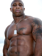 Ebony bodybuilder outdoors