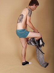 Tall skinny tattooed Pete Crash blows his load onto tummy.