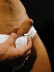 Super fit Jim Woods tugging on his hard cock.